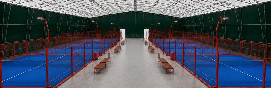 Inside the Manx Padel arena — six floodlit courts under cover
